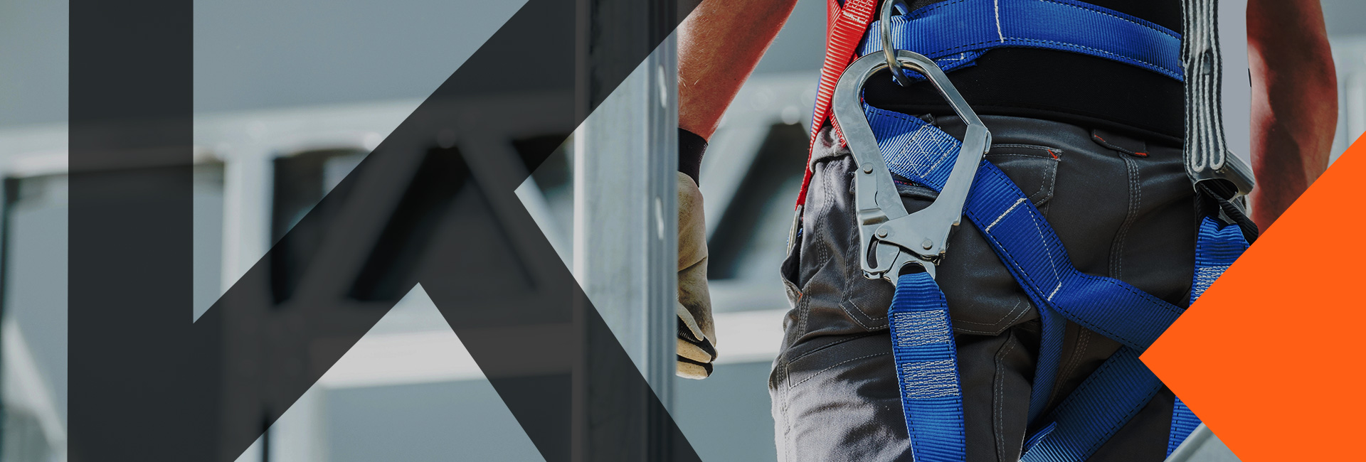Construction-worker-wearing-a-harness-for-working-at-heights-with-letter-k-as-overlay