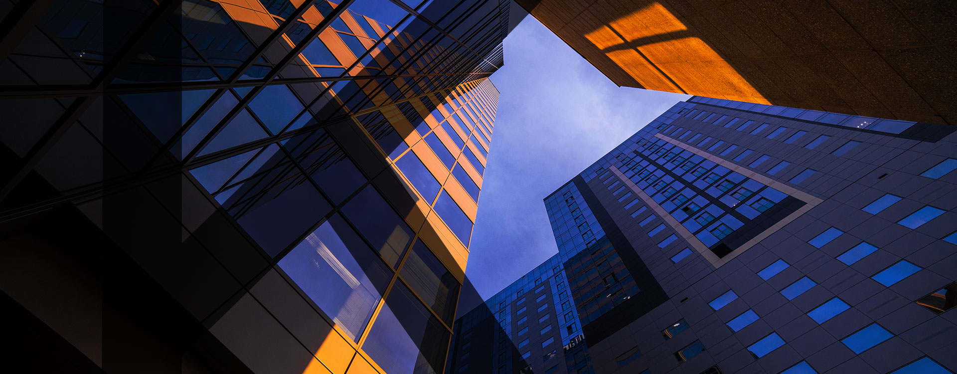 Skyscraper-buildings-taken-from-below-in-sunset-with-Khusela-letter-K-overlay-smaller