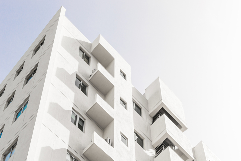 White-apartment-building-photo-taken-from-the-bottom-at-an-angle