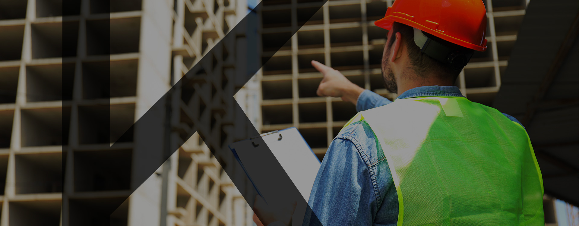 Construction-planner-pointing-towards-building